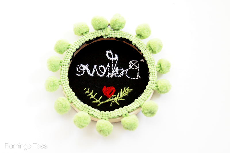 Glue pom pom trim to hoop